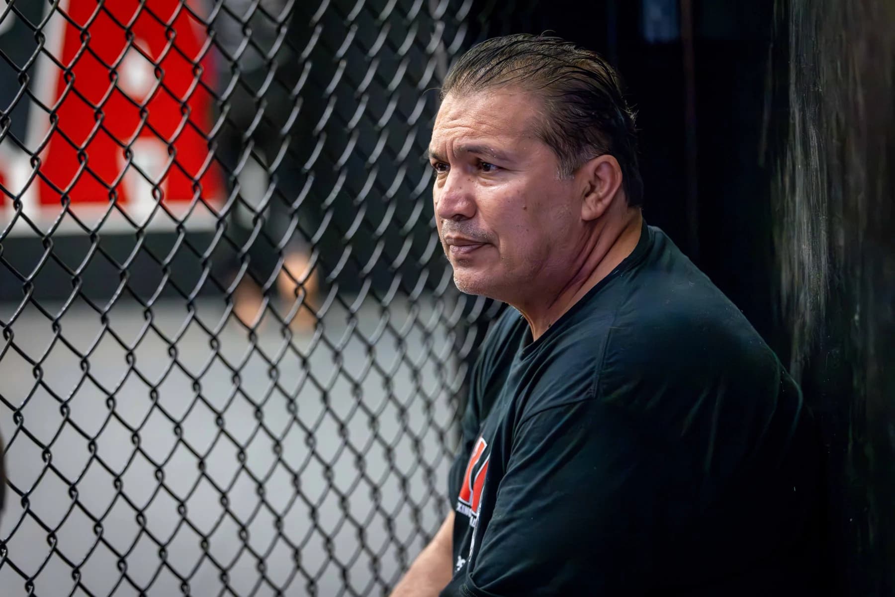 Javier Mendez beside the cage at AKA
