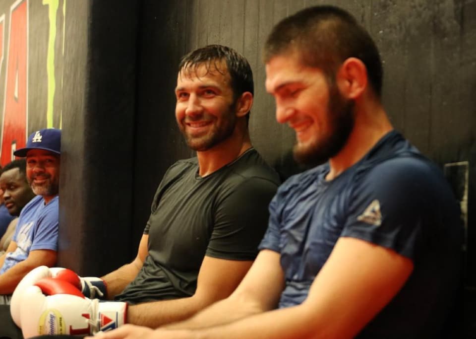 Luke Rockhold seated beside Khabib Nurmagomedov at AKA